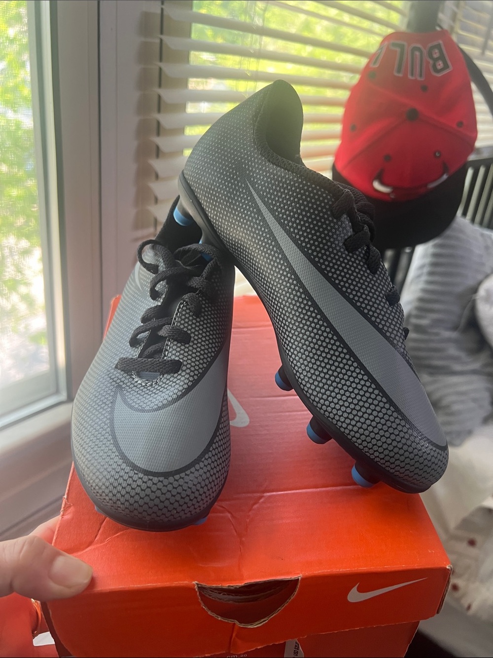 Nike Grey and Black Youth Soccer Cleats with Blue Studs